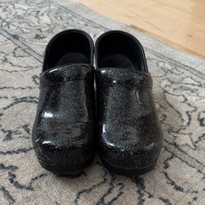 Dansko Black Glitter Clogs